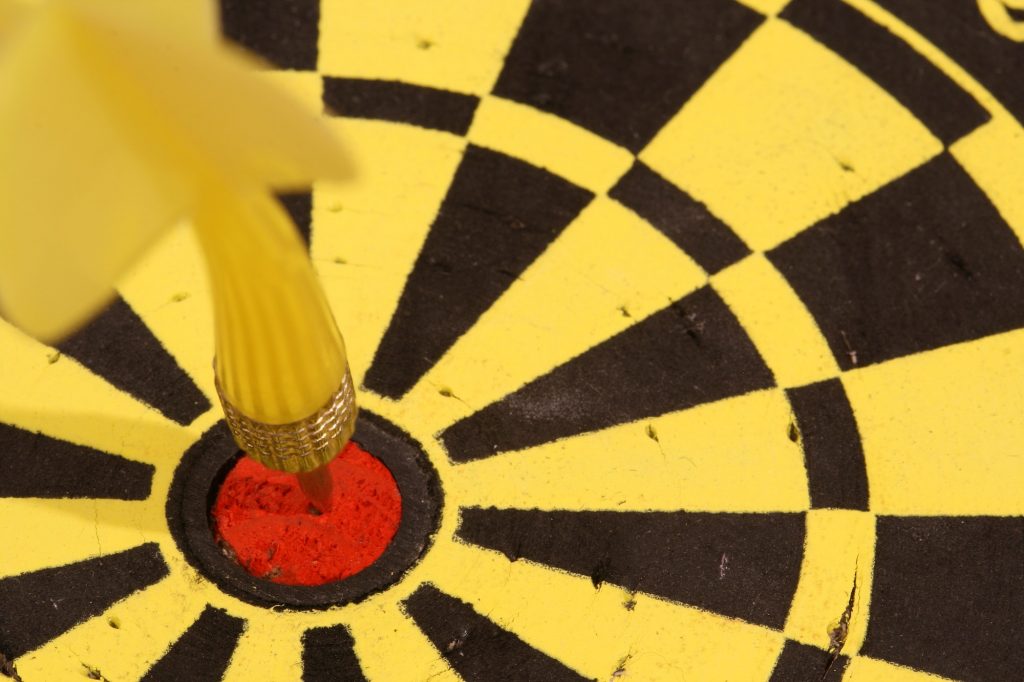 Bulls eye on darts, closeup. Concept of winning attitude and focusing on your goals.
